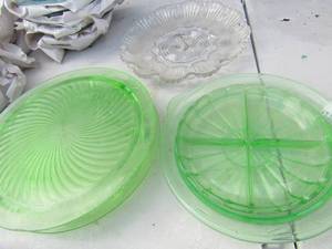 lot 223 image: Uranium glass - 2 green glass cake plates, 1 4 tier divided tray 10 green glass plate