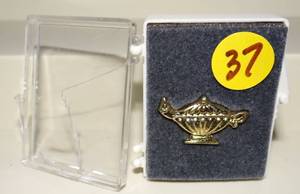 lot 37 image: COOL GENIE LAMP PIN AS SHOWN
