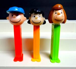 lot 149 image: MADE IN SLOVENIA - Peanuts Charlie Brown Vintage Pez Candy Dispenser 4.9 Peppermint Patty, Charlie Brown, and Lucy