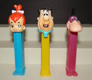 lot 178 image: VINTAGE THE FLINTSTONES PEZ DISPENSERS (FRED, PEBBLES, & DINO)