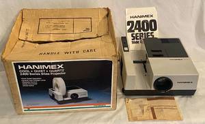 lot 73 image: Vintage Hanjmex 2400 Series Slide Projector, Remote Contol and Manuel