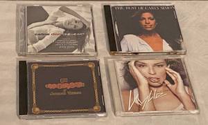lot 87 image: 4 CD�s Celine Dion One Heart The Best of Carly Simon The Worst of Jefferson Starship Minoque Kylie Fever