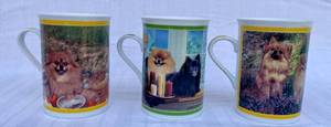 lot 131 image: Danbury Mint Mugs Pom Picnic Waiting at the Window, Hiding in the Heather