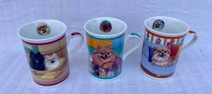 lot 132 image: Danbury Mint Mugs Bath Time, At the Beach, Sitting Pretty
