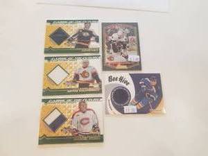lot 45 image: Selection of 5 game worn jersey Hockey cards