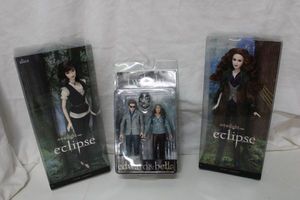lot 9 image: Twilight Eclipse Pins and Dolls- Alice, Edward and Bella and Victoria still in Boxes