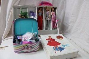 lot 16 image: Barbie Dolls and Clothes with Cases