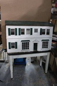 lot 31 image: Large Doll House on Rolling Table - each measure 2 feet Tall