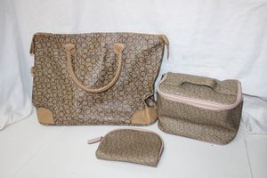 lot 33 image: Calvin Klein Set Large Handbag and 2 Cosmetic Travel Bags as shown
