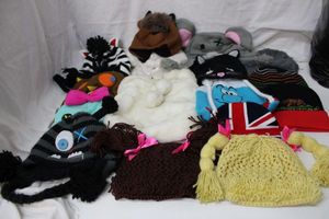 lot 48 image: Fun Animal, Plush, and Knit Hats, Plus Old Navy Plush Bag see pictures