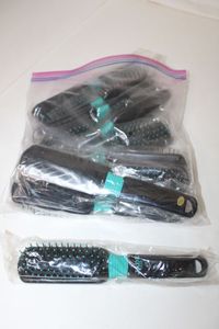 lot 68 image: 10 Unopened Jade Colored Hair Brushes