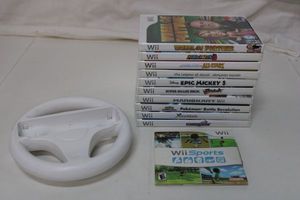 lot 81 image: Wiii Games and Wii Steering Wheel