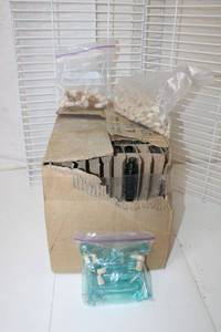 lot 145 image: Colored Tiny Glass Bottles and Corks Includes Mostly Full Box of 1 oz. Sierra Spray Green Bottles