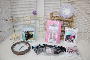 lot 163 image: Jewelry Hangers, Locker Light, Glitter Clock, Purple Clock, Pink Curtains, Face Masks and Wicker Shelf