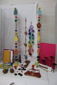 lot 166 image: Cat Toy, Rainbow Dreamcatcher, Wooden Painted Hands Wall Hangers, Day of the Dead Ceramic Wind Chime, Wire Hinged Candle Holder,  Incense and More