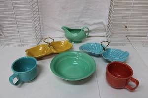 lot 175 image: Fiesta Dishes Soup Mugs, Gravy Boat, Serving Bowl(unmarked) and Snack Dishes marked Calif. USA)