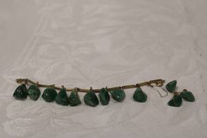 lot 364 image: Jadeite tumbled stone bracelet (missing one) with single Jadeite tumbled stone earring (butterfly back marked 14K). No other markings. Jadeite tested.