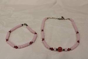 lot 366 image: Pink glass necklace and bracelet set. 16L necklace, 10L bracelet. Light pink beads tested as glass. Deeper pink spacers and center ball probably Rose quartz.