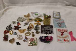 lot 378 image: Brooch and pin selection. Includes brooches, pins, lapel pins plus. Varying materials and subjects