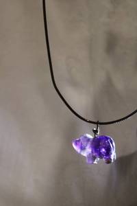 lot 388 image: Sterling Silver 12L choker with Ametrine bear fetish amulet. When held to the light you can see the ombre Amethyst and Quartz variations. Marked 925 Italy