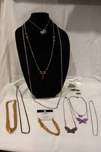 lot 392 image: White metal necklaces. Varying styles & makers. 12 count