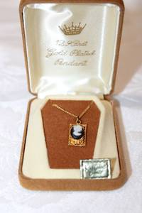 lot 379 image: 12K gold plated cameo pendant necklace in original box. Hand carved cameo.