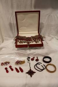 lot 431 image: RED jewelry selection. Includes large statement necklace in fitted box, bracelets, earrings plus