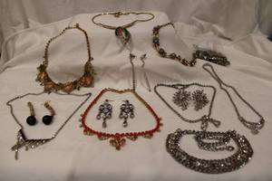 lot 396 image: Rhinestone and crystal bling jewelry selection. Varying styles and sizes. Includes necklaces, earrings plus