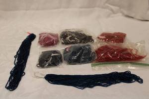 lot 402 image: Beaded necklaces and bead strings. Varying colors and lengths.