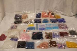 lot 403 image: Jewelry making beads and beading. Varying shapes, colors. In packages. Generous quantity