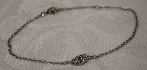 lot 422 image: Sterling Silver 8L bracelet with center station in leaf form. Marked 925 in two locations.