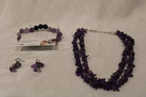 lot 416 image: Double strand 16L Amethyst chip bead necklace and a carded Amethyst and Lava bead stretch bracelet. Amethyst tested on both. Also includes a pair of Amethyst chip bead dangle earrings