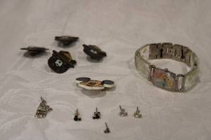 lot 425 image: Collectible character jewelry. Includes Disney Princess watch, Mickey Mouse pin and Mickey Mouse earrings, Royal Bee pendant and Smokey The Bear lapel pins.