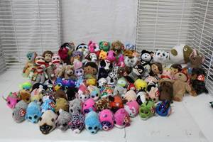 lot 523 image: Large assortment of TY Beanie Babies (including sock monkeys and Barbie) plus a few stuffed toys