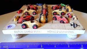 lot 91 image: HEN FEATHERS - MONOCO GRAN PRIX DISPLAY WITH STONE CARVED REMOVEABLE CARS
