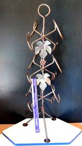 lot 119 image: ORNATE METAL FREE STANDING 6 BOTTLE WINE RACK