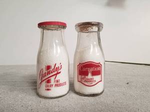 lot 51 image: Selection of 2 glass milk bottles - Gandys and Carnation