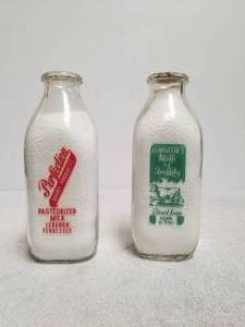 lot 93 image: Selection of 2 glass milk bottles - Elmartins Milk & Perfection Dairy