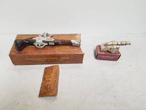 lot 110 image: Selection of 2 Avon bottles - Dueling pistol and Revolutionary cannon
