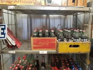 lot 118 image: Coca-Cola Coke full and empty bottle shelf lot