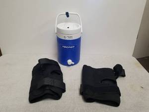 lot 130 image: Pair of knee braces and a CryoCuff cold therapy system