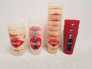 lot 131 image: Selection of plastic Coca Cola cups - varies sizes