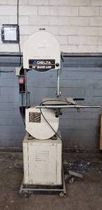 lot 14 image: Delta 14 Bandsaw with Delta Cabinet and Delta Rolling Base