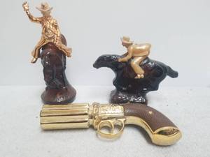 lot 125 image: Selection of 3 western themed Avon after shave decanters -