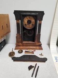 lot 187 image: Mantle windup wall clock - for parts or repair - has key