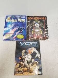 lot 59 image: Selection of Gaming Books - Gundam Wing, StoryTeller Secrets, and VOR