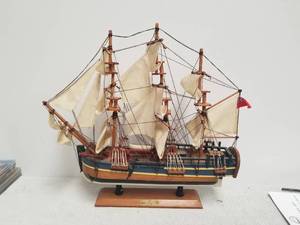 lot 67 image: Wooden boat - USS Endeavour -  17 by 18 inches