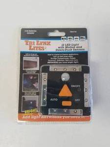 lot 247 image: LYNX 12-LED LIGHT WITH MOTION AND DAWNDUSK SENSORS  BLACK- #00027B