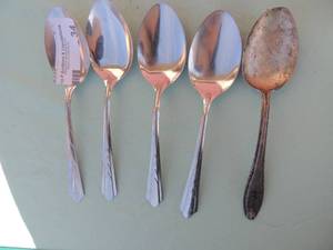 lot 34 image: Sterling Leonarde by Manchester serving spoon and 4 stainless serving spoons