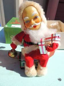 lot 81 image: Vintage Hallmark santa battery powered on tin chimney . Rings bell, moves in original box with instructions